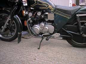 [Left view of bike with partial exhaust ]