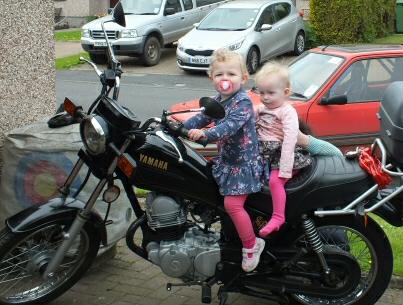 [Hattie and Bell on motorbike]